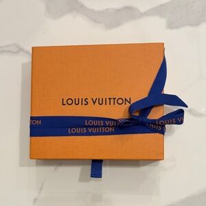 Louis Vuitton Vibrant Orange Box with Bold Blue Ribbon